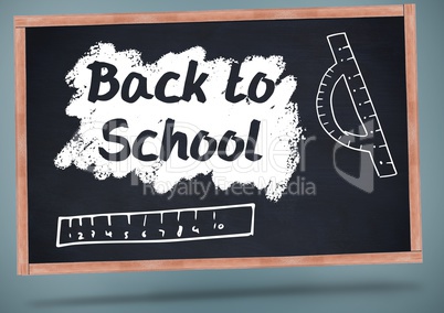 back to school on blackboard with chalk and rulers