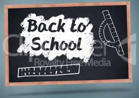 back to school on blackboard with chalk and rulers