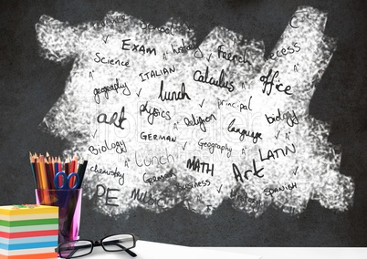 Desk foreground with blackboard graphics of school subjects