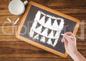 Hand drawing flags on blackboard with coffee
