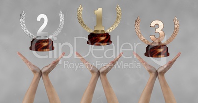Women with trophies on hands