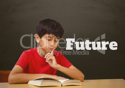 Student boy at table reading against grey blackboard with future text