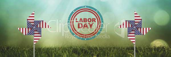 labor day text and USA wind catchers in front of grass and sky