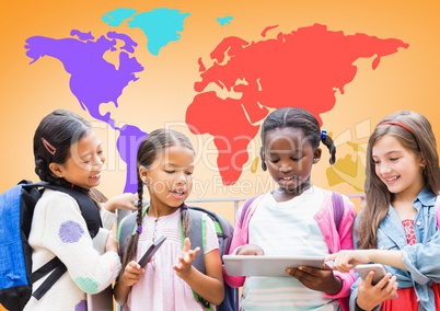 Multicultural Kids on devices in front of colorful world map