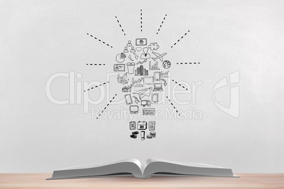 Book on the table against white blackboard with bulb graphic