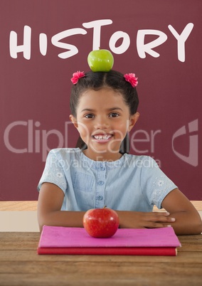 Happy student girl at table against red blackboard with history text