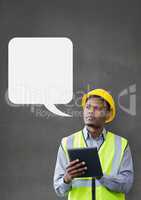 Construction man looking up with speech bubble against grey background