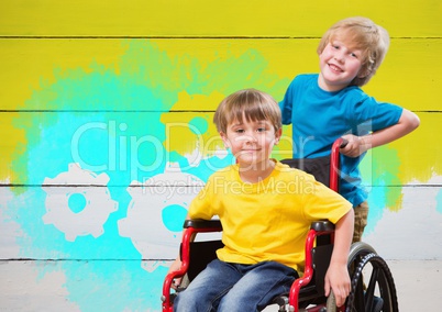 Disabled boy in wheelchair with painted yellow background and settings cogs gears