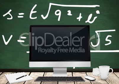 Computer Desk foreground with blackboard graphics of formulas