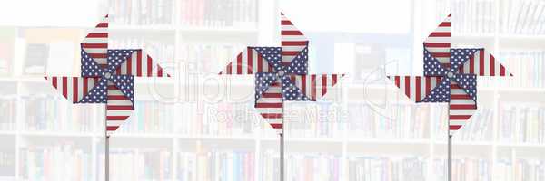 USA wind catchers in front of library shelves