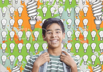 Student in front of colorful light bulbs graphics