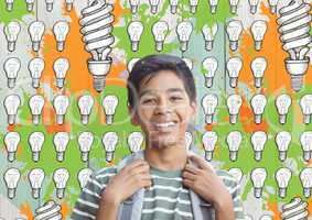 Student in front of colorful light bulbs graphics