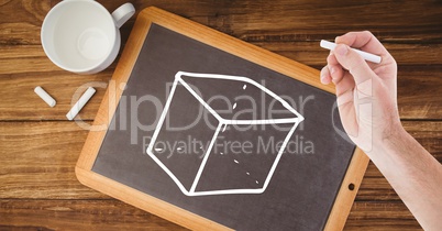 Hand drawing cube on blackboard