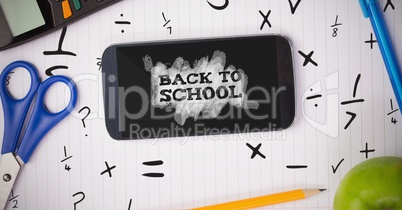 Phone on a school table with back to school text on screen