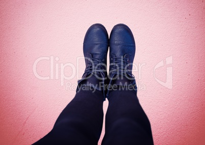 Blue shoes on feet with red background