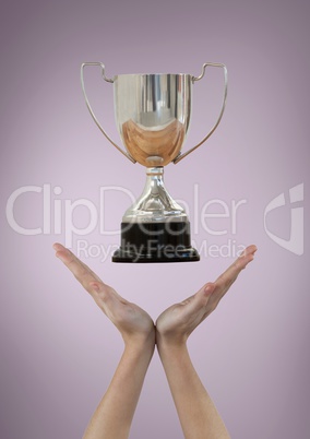 Woman with a trophy on hands