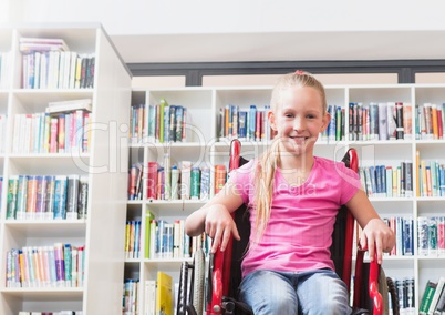 Disabled girl in wheelchair in school library