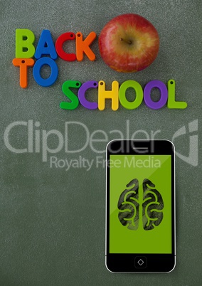 Phone on a school table with brain icon on screen