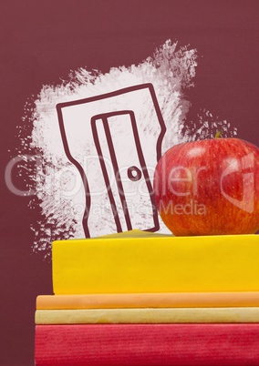 Books on the table against red blackboard with education and school graphic