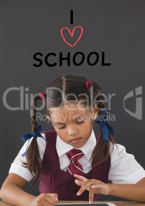 Student girl at table thinking against grey background with I love school text