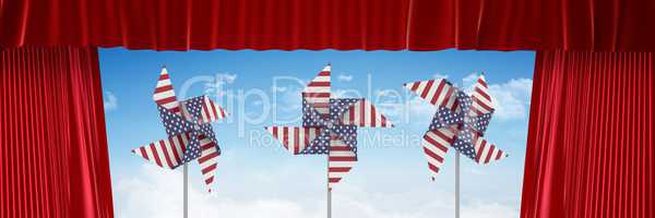 USA wind catchers in front of sky and red curtain