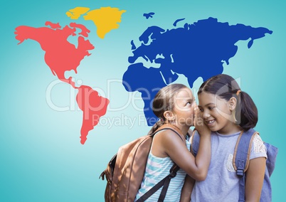 Schoolgirls whispering in front of colorful world map