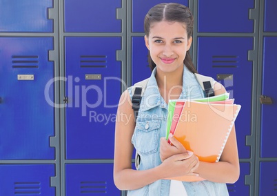 female student holding files in front of lockers