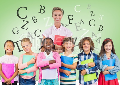 Many letters around Kids holding schoolbooks with teacher in front of green background