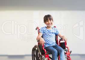 Disabled girl in wheelchair in school