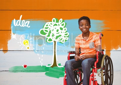 Disabled boy in wheelchair with idea colorful drawings