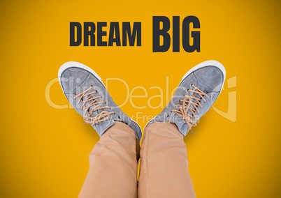 Dream Big text and Grey shoes on feet with yellow background