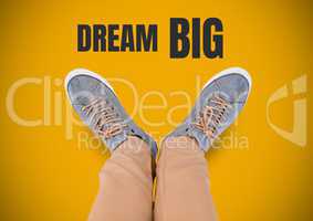 Dream Big text and Grey shoes on feet with yellow background
