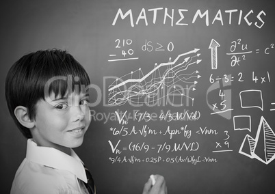 mathematics text and equations on blackboard with boy