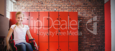 Composite image of girl sitting in wheelchair in school corridor