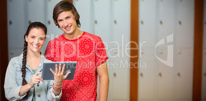 Composite image of smiling classmates with tablet pc