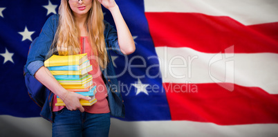 Composite image of pretty student in the library