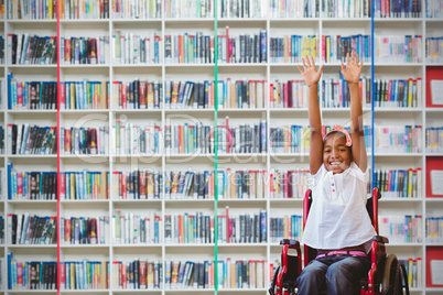 Composite image of girl in wheelchair in school corridor