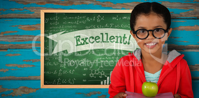 Composite image of happy girl holding books and apple