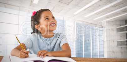 Composite image of girl looking up while sitting at desk