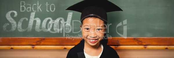 Composite image of portrait of smiling girl wearing mortarboard