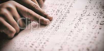 Child using braille to read