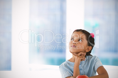 Composite image of thoughtful girl against white background