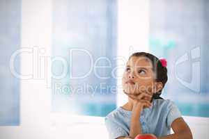 Composite image of thoughtful girl against white background