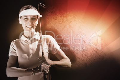 Composite image of woman playing golf