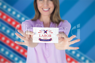 Composite image of smiling businesswoman showing blank sign