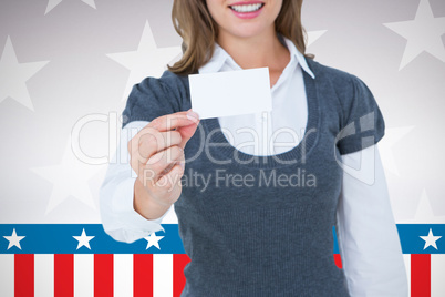 Composite image of smiling woman showing card