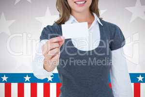 Composite image of smiling woman showing card