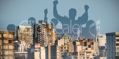 Composite image of silhouetters celebrating