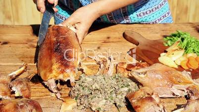 Roasted Goose Meat Being Chopped On Wooden Table