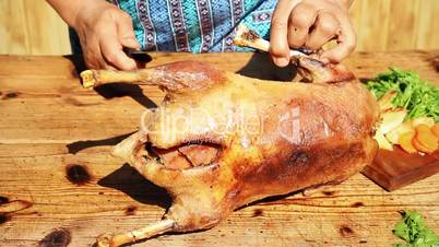 Roasted Goose Meat Being Chopped On Wooden Table